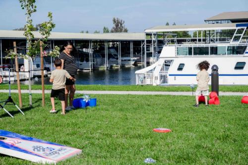 people on grass at marina